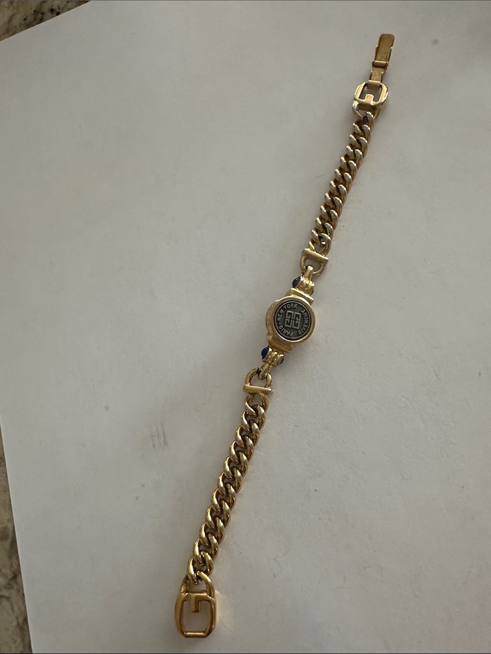 Givenchy Gold-Tone Chain Bracelet with Logo and blue stones on side 7.25”